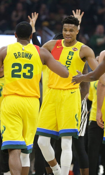 Bucks beat Hawks 115-107 for 60th win